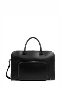 Sac à main en cuir noir avec une texture lisse, présentant des poignées doubles, une bandoulière amovible et une poche zippée à l'avant.