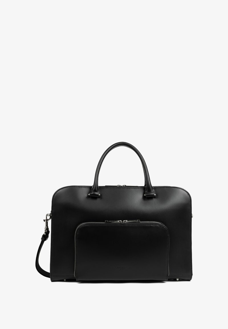 Sac à main en cuir noir avec une texture lisse, présentant des poignées doubles, une bandoulière amovible et une poche zippée à l'avant.
