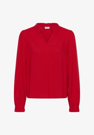 Piros blúz hosszú, fodros ujjakkal, V-nyakkivágással és a gallérnál összegyűrt fodros részlettel. Puha, sima tapintású anyagból.