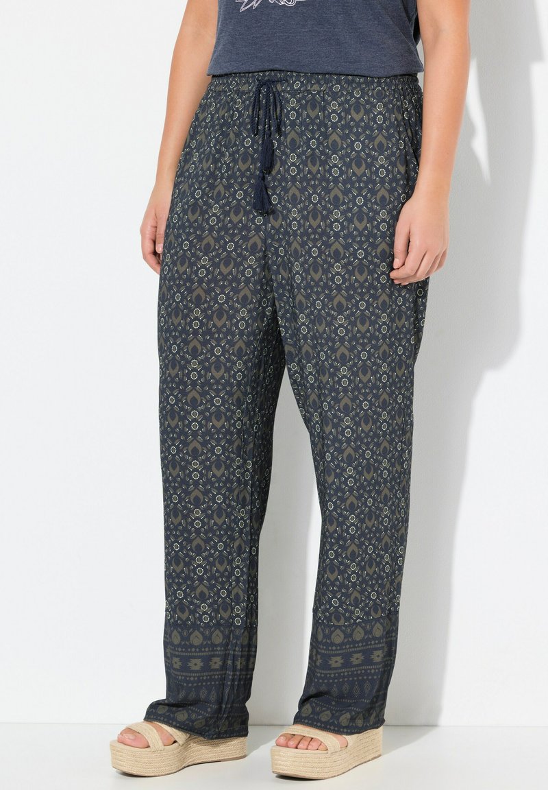 Navy-gepatroneerde wijde broek met een elastische taille, voorzien van bloem- en geometrische ontwerpen. Gemaakt van lichte stof.