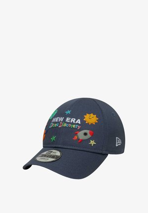 Navy blue cap with embroidered space-themed designs, including a rocket, sun, and stars. Features a curved brim and New Era branding.