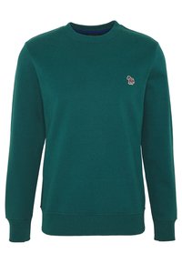 Sweatshirt en polaire verte avec un col rond. Il présente un petit motif brodé sur la poitrine et des poignets côtelés aux manches.