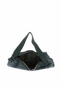 Sac crossbody en nylon vert avec une surface texturée, une bandoulière réglable et une ouverture zippée révélant une doublure intérieure marron ornée d'un motif logo.