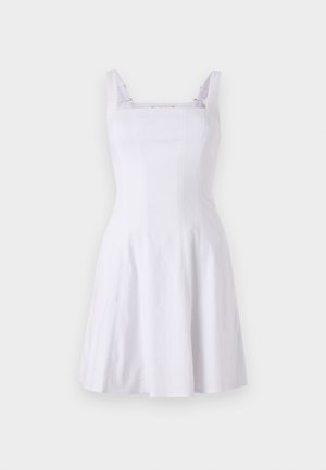 White sleeveless dress with a fitted bodice, square neckline, and an A-line skirt. Crafted from textured fabric with contrasting straps.