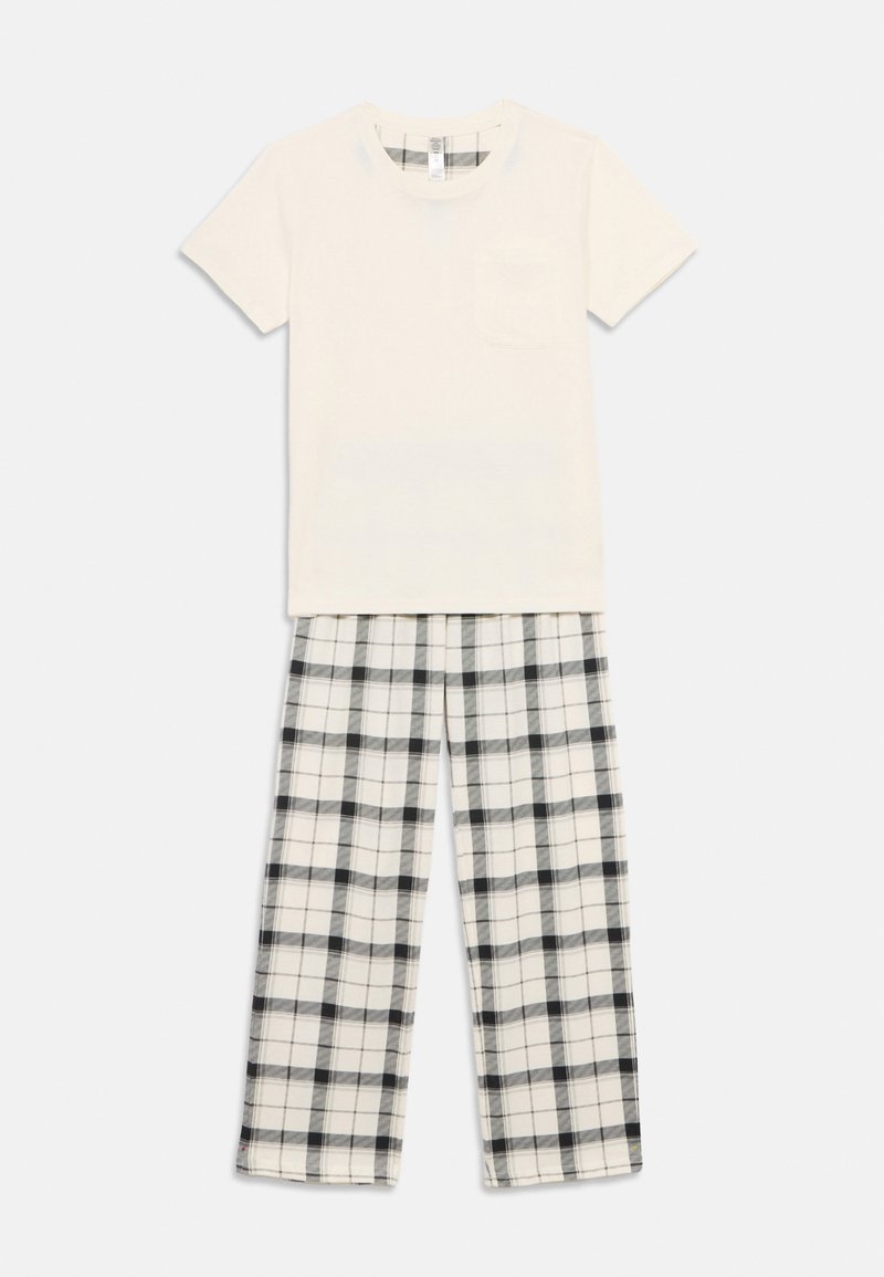Σετ πυτζάμες από βαμβάκι που περιλαμβάνει ένα κρεμ πουκάμισο με κοντά μανίκια και τσέπη, καθώς και παντελόνι με καρό σχέδιο σε μαύρο και άσπρο. Χαλαρή εφαρμογή.