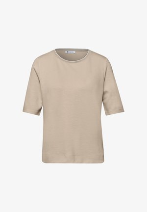 Beżowa koszulka z krótkim rękawem i okrągłym dekoltem, z prostym dołem i małą białą metką marki wewnątrz kołnierza.