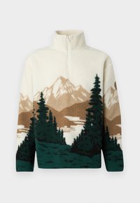 Cream fleece pullover with half-zip, featuring a landscape design of brown mountains, dark green pine trees, and a lake.