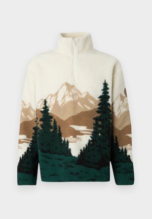 Cream fleece pullover with half-zip, featuring a landscape design of brown mountains, dark green pine trees, and a lake.