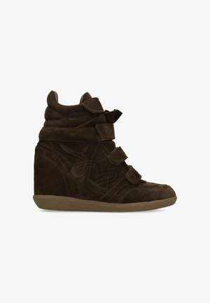 Dark brown suede wedge sneaker with three Velcro straps and a rubber sole, shown from the side on a white background.