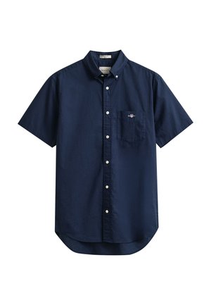 Chemise bleu marine à manches courtes avec boutons, col boutonné et poche poitrine avec petit logo brodé.