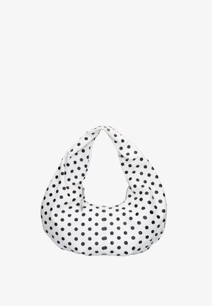 Sac à main blanc à pois noirs, doté d'une forme douce en croissant et d'une large anse en boucle.
