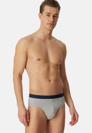 Graue Baumwollslips mit einem marineblauen Bündchen, das den Markennamen trägt. Klassischer Schnitt mit glatter Textur und elastischer Passform.