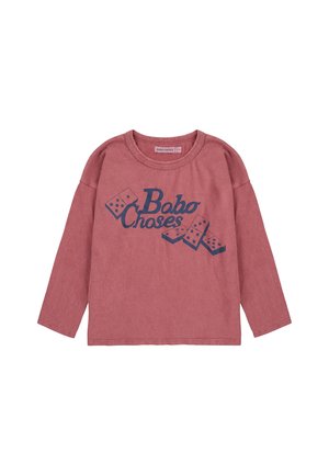 Long-sleeve, pink cotton shirt featuring a navy graphic text “Bobo Choses” with domino illustrations, relaxed fit, and crew neck design.