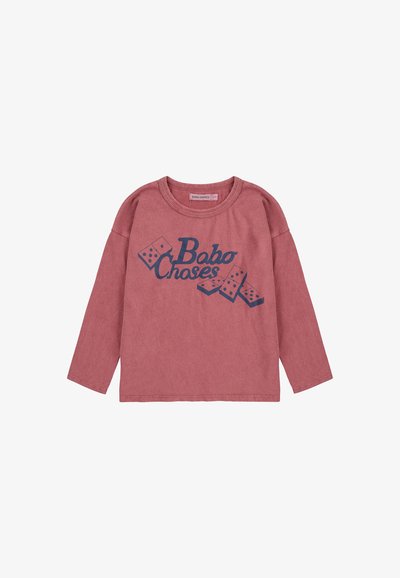 Košulja dugih rukava, ružičaste boje od pamuka, s mornarsko plavim grafičkim tekstom "Bobo Choses" i ilustracijama domina, opuštenog kroja i dizajnom s okruglim izrezom.