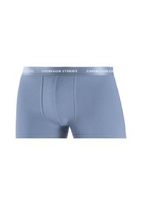 Mid-rise blue boxer briefs made of soft fabric, featuring a white waistband with "COPENHAGEN STUDIOS" text and a snug fit design.