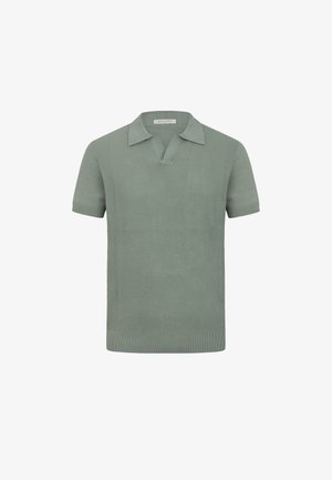Polo a maniche corte in maglia verde chiaro con pannello anteriore testurizzato e colletto morbido, etichettato Dan John.