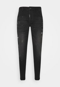 Mustat farkut slim-fit-mallilla, joissa on kulutettuja yksityiskohtia, haalistuneita kohtia ja pieniä maalisplättereitä edessä ja takana.