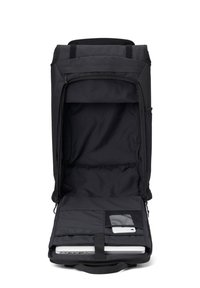 Black backpack with a spacious interior, laptop compartment, and a mesh pocket for accessories. Made from durable fabric, designed for functionality.