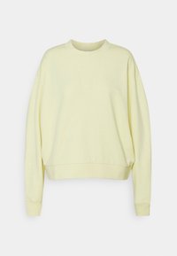 Sweat-shirt jaune à col rond, épaules tombantes et poignets côtelés. Tissu doux et coupe décontractée. Design simple et sans ornement.