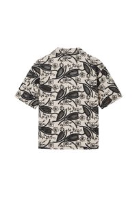 Chemise beige à manches courtes avec motif floral et feuillage noir couvrant le tissu, vue de dos.