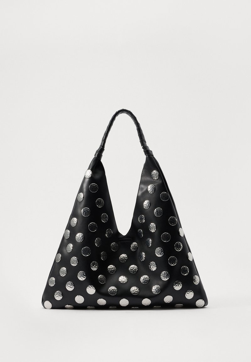 Black leather bag with a triangular shape, featuring silver metallic polka dots and a textured handle. Smooth finish overall.