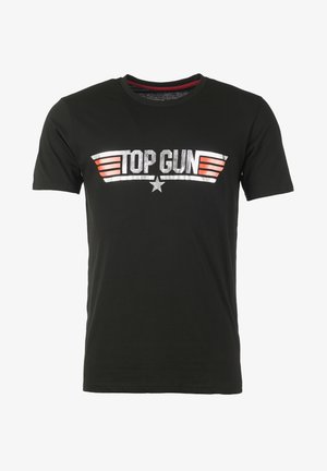 Mustat puuvillapaitat, joissa on teksti "TOP GUN" hopeisena ja punaisena, siipigrafiikoilla ja tähtikoristeella tekstin alla. Lyhyt hihoinen, pyöreä kaula-aukko.