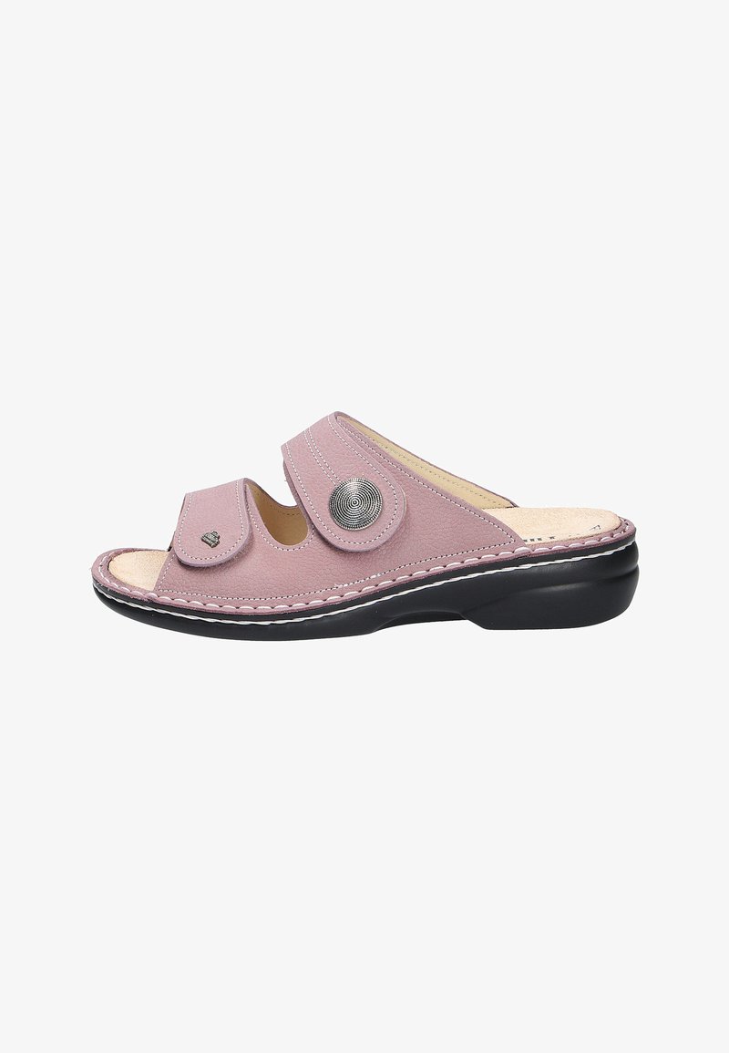 Pink leather slide sandal with two adjustable straps, silver-tone decorative button, and black rubber sole with white stitching detail.