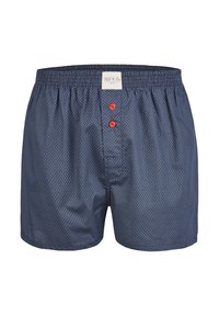 Námornické modré boxerky s malým geometrickým vzorem, elastickým pasem a dvěma červenými knoflíky na přední straně. Štítek umístěný na pasu.