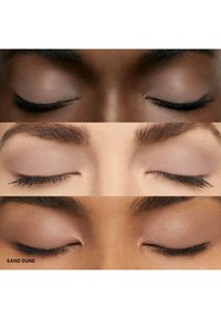 Three sets of closed eyes with various skin tones, showcasing a neutral eyeshadow in a matte finish labeled "Sand Dune."