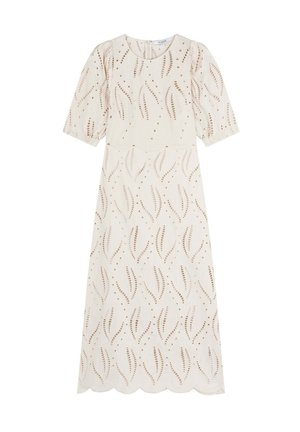 Kremowa sukienka z teksturowanym kwiatowym wzorem, krótkimi bufiastymi rękawami i falbanistym dołem. Posiada dekoracyjne wycięcia oraz subtelne brązowe akcenty.