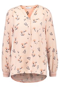 Blusa pescozza chiara in morbido tessuto con maniche lunghe, caratterizzata da un motivo floreale in corallo e blu navy. Scollo a V e orlo arrotondato con polsini elastici.