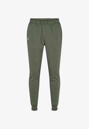 Žalios spalvos sportinės kelnės iš minkštos medžiagos, su raišteliu juosmens srityje, įrėmintomis rankogaliais ir mažyliu logotipu kairėje šlaunies dalyje.