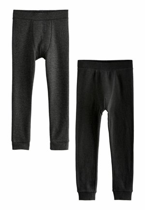 Kaksi paria lämpimiä leggingsejä tummissa sävyissä. Toisessa on ribbitekstuuri; molemmissa on joustavat vyötäröt ja istuvat hihnat nilkoissa.