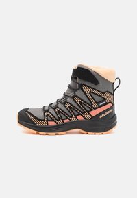 Black and gray hiking boot with an orange stripe. Features a textured upper, padded collar, and rubber sole with pronounced tread for traction.