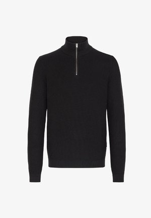 Černý pletený svetr s vysokým límcem a krátkým zipem. Žebrovaná textura a přiléhavé dlouhé rukávy dodávají struktuře a stylu.