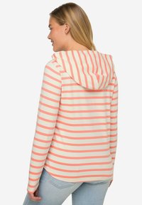 Stripet langærmet hoodie i creme og koral, med hætte og afslappet pasform. Struktureret stof med en glat overflade.