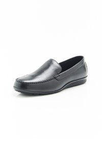 Scarpa nera in pelle senza lacci con una finitura liscia, dettagli di cucitura lungo la punta, forma arrotondata e suola in gomma per una buona aderenza.