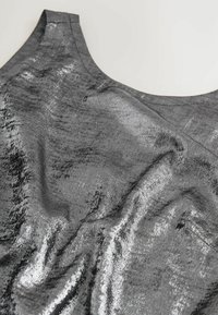 Shiny gray fabric with a smooth texture and subtle sheen, featuring curved neckline and wrinkled design details.