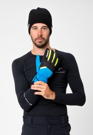 Blue insulated gloves with black accents, featuring grip texture and reflective stripes. Black knit beanie and fitted black base layer top.