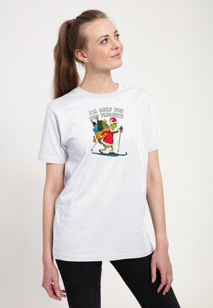Weißes Baumwoll-T-Shirt mit einem grafischen Design eines Charakters in einem roten Outfit, der Geschenke trägt, mit dem Text "ICH BIN HIER FÜR DIE GESCHENKE."