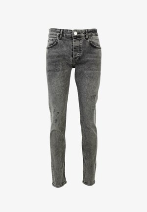 Jean en denim gris avec un lavage décoloré, design à cinq poches, jambe droite, fermeture à bouton et détails d'usure subtils.