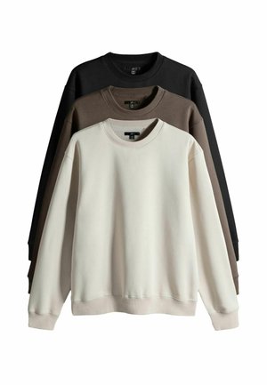 Drei Sweatshirts in Creme, Braun und Schwarz. Baumwollmischung, gerippter Rundhalsausschnitt und Bündchen. Weiche Textur mit lockerer Passform.
