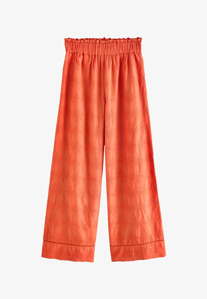 Pantalon orange à jambes larges avec taille élastique, broderie florale subtile et ourlet festonné.