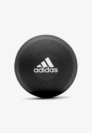 Black rubber weight with a textured surface and a circular shape. Features a white Adidas logo on a black circular background.