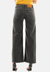 PLEASE Jeans a zampa - gris