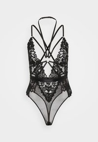 Μαύρο κορμάκι από δαντέλα με λουράκια που διασταυρώνονται στην πλάτη, περίπλοκα λουλουδένια σχέδια, διαφανή τμήματα από διχτυωτό ύφασμα και κυκλικό μεταλλικό διακοσμητικό στο κέντρο.