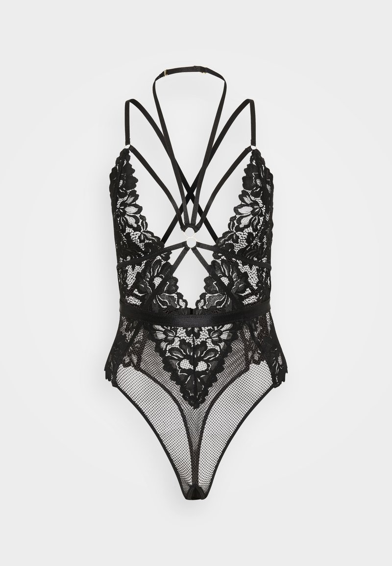 Μαύρο κορμάκι από δαντέλα με λουράκια που διασταυρώνονται στην πλάτη, περίπλοκα λουλουδένια σχέδια, διαφανή τμήματα από διχτυωτό ύφασμα και κυκλικό μεταλλικό �διακοσμητικό στο κέντρο.