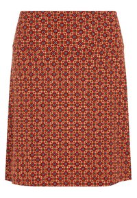 Hög midja A-linje kjol med en orange botten som har ett upprepande geometriskt mönster i röda, svarta, vita och beige nyanser.