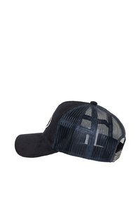 Navy cap with a solid front and mesh back, features a curved brim and an emblem on the front. Textured fabric and adjustable strap at the back.