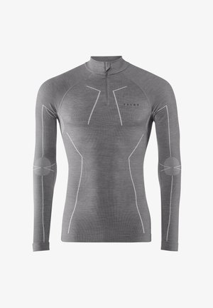 Grijze longsleeve top met een halve rits kraag, voorzien van witte accentsteek en elleboogpatches. Gemaakt van een textiel met structuur voor extra warmte.